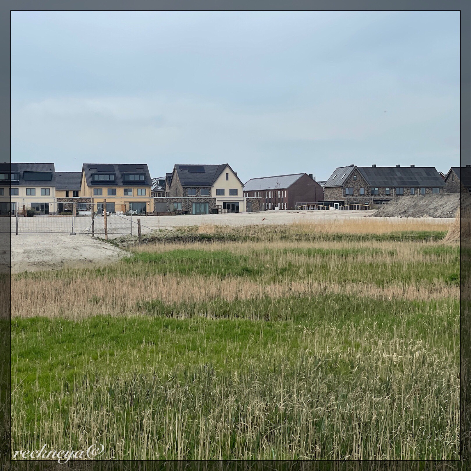 Photo taken in Roelofarendsveen. These are newly built houses. Their yards are small, and very few do not come with solar panels. They were built on former farmland.